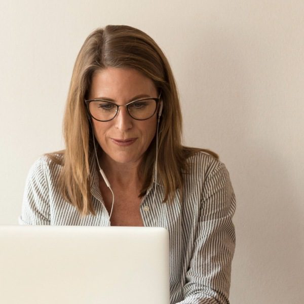 Woman staring into laptop computer