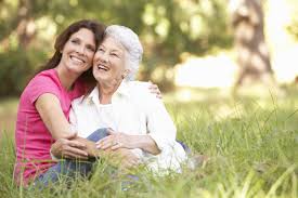Senior woman hugging elderly mother