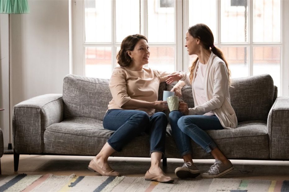 Women talking on couch