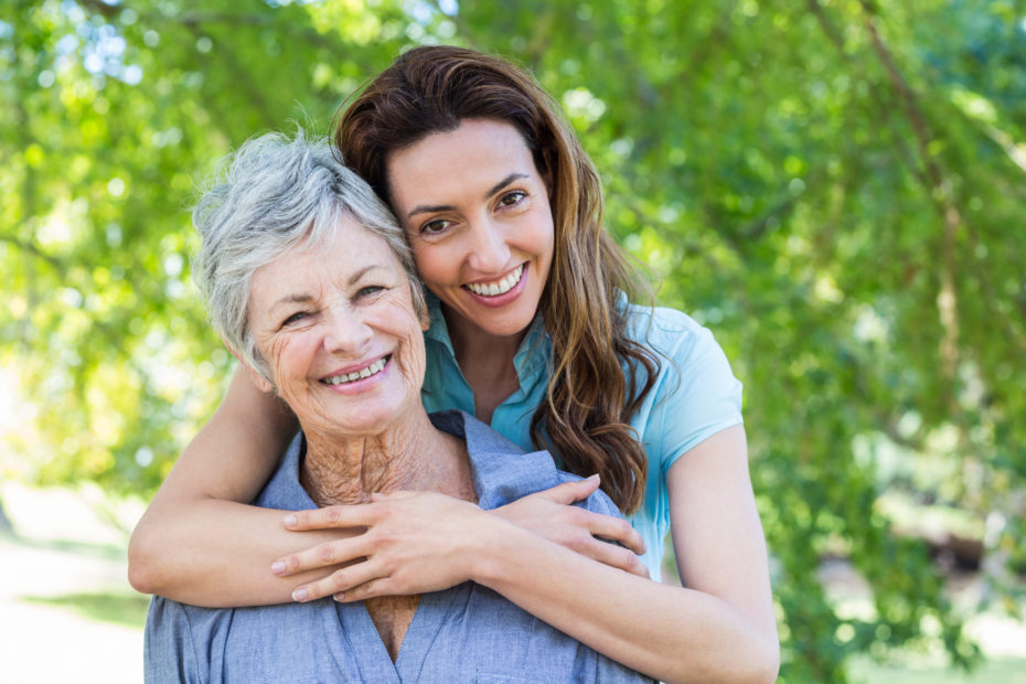 Senior mom and and adult daughter hugging