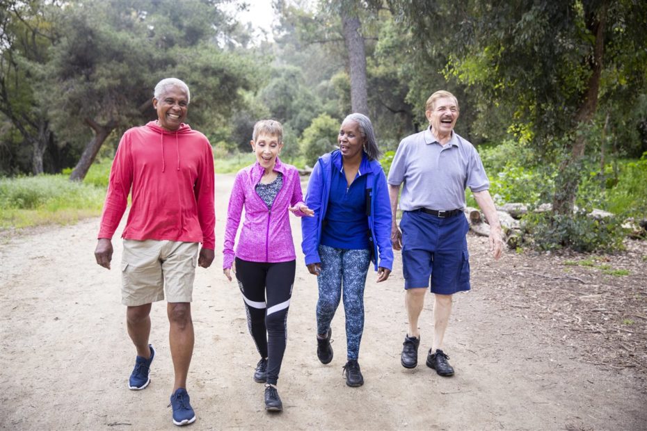 Seniors walking outdoors and laughing