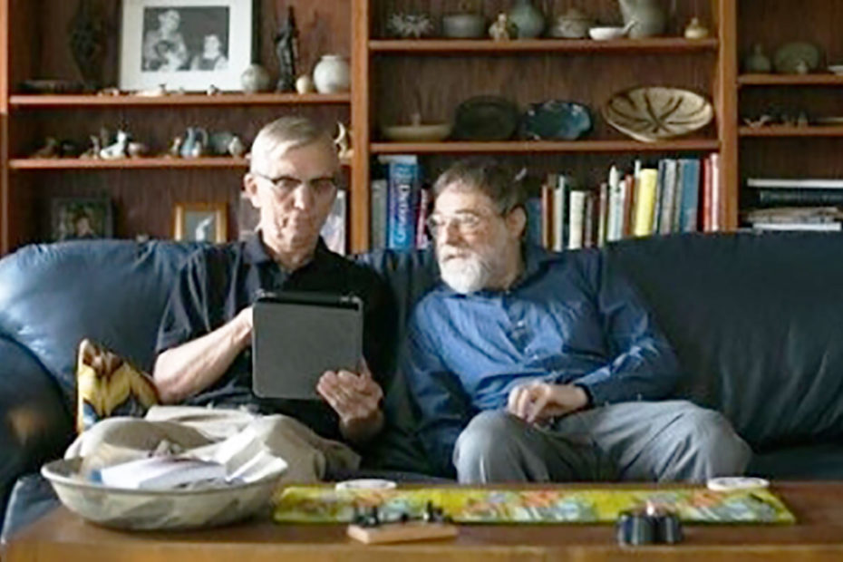 men-looking-at-products-on-tablet