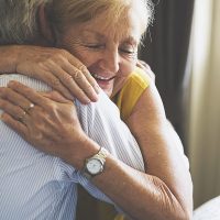 senior older man lady hugging
