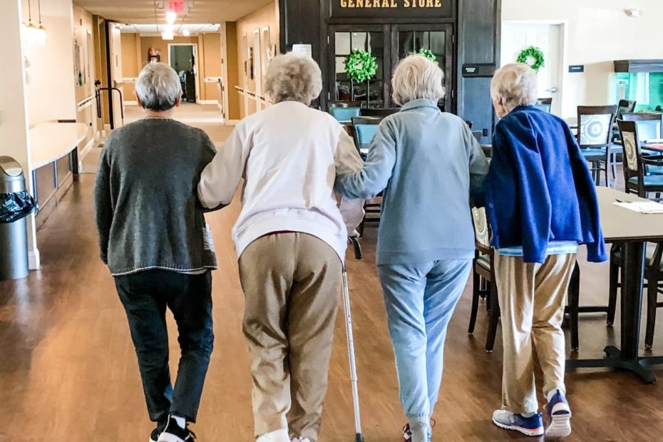 Senior ladies walking arm-in-arm