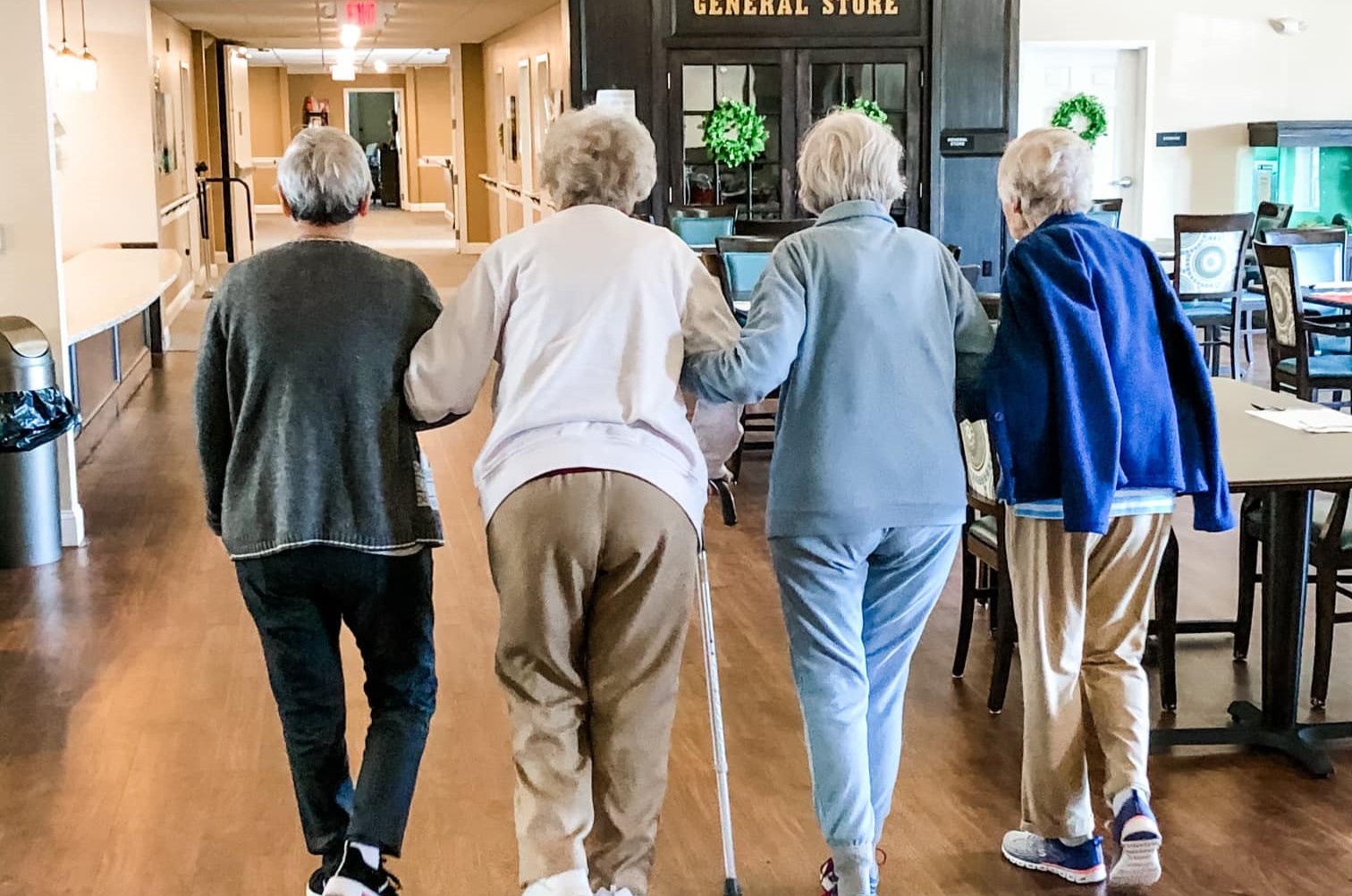 Senior ladies walking arm-in-arm