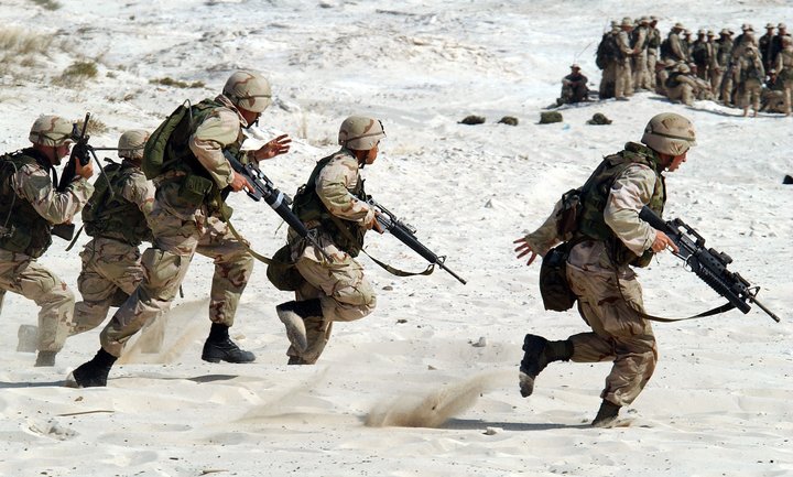 Soldiers running with weapons
