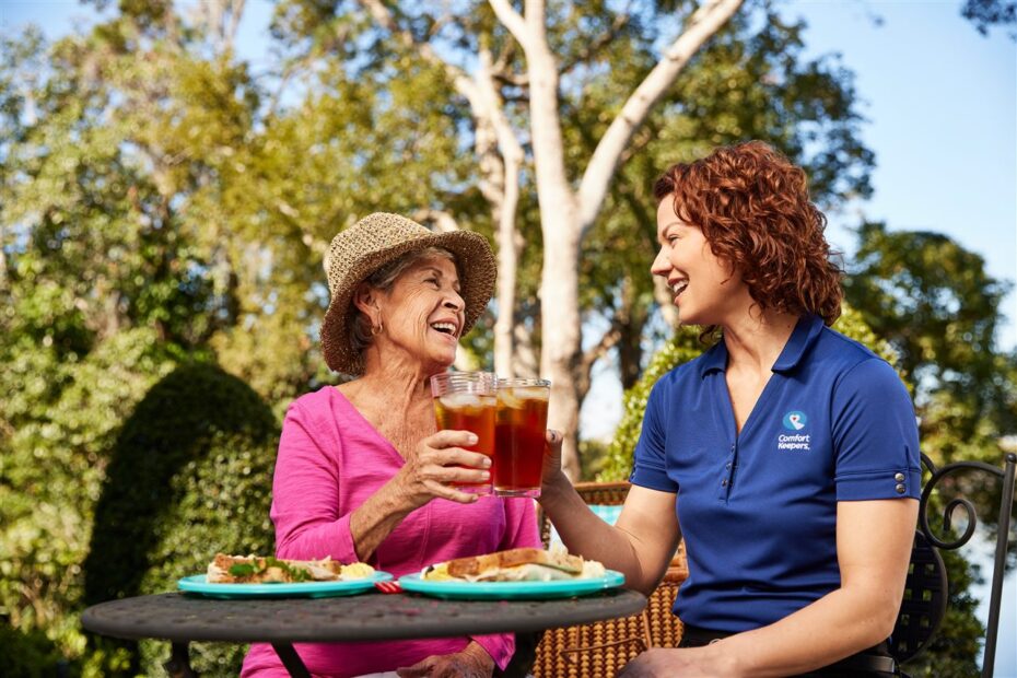 Woman and dementia patient outdoors