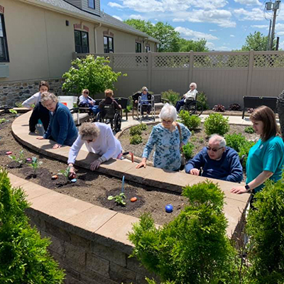 Seniors gardening at South Mountain Memory Care